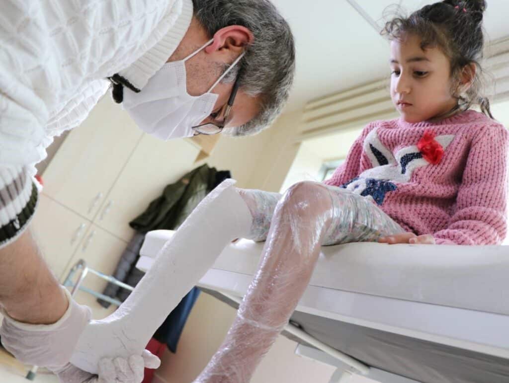 Child with prosthetic leg